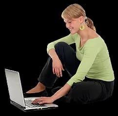 A woman reading at a laptop.